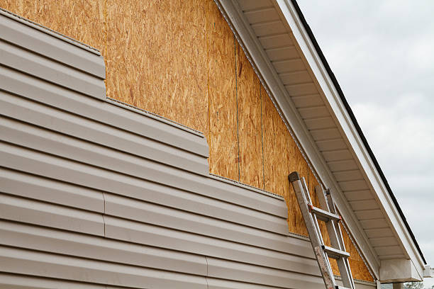 Professional Siding Contractor technician working in Huntsville, TX